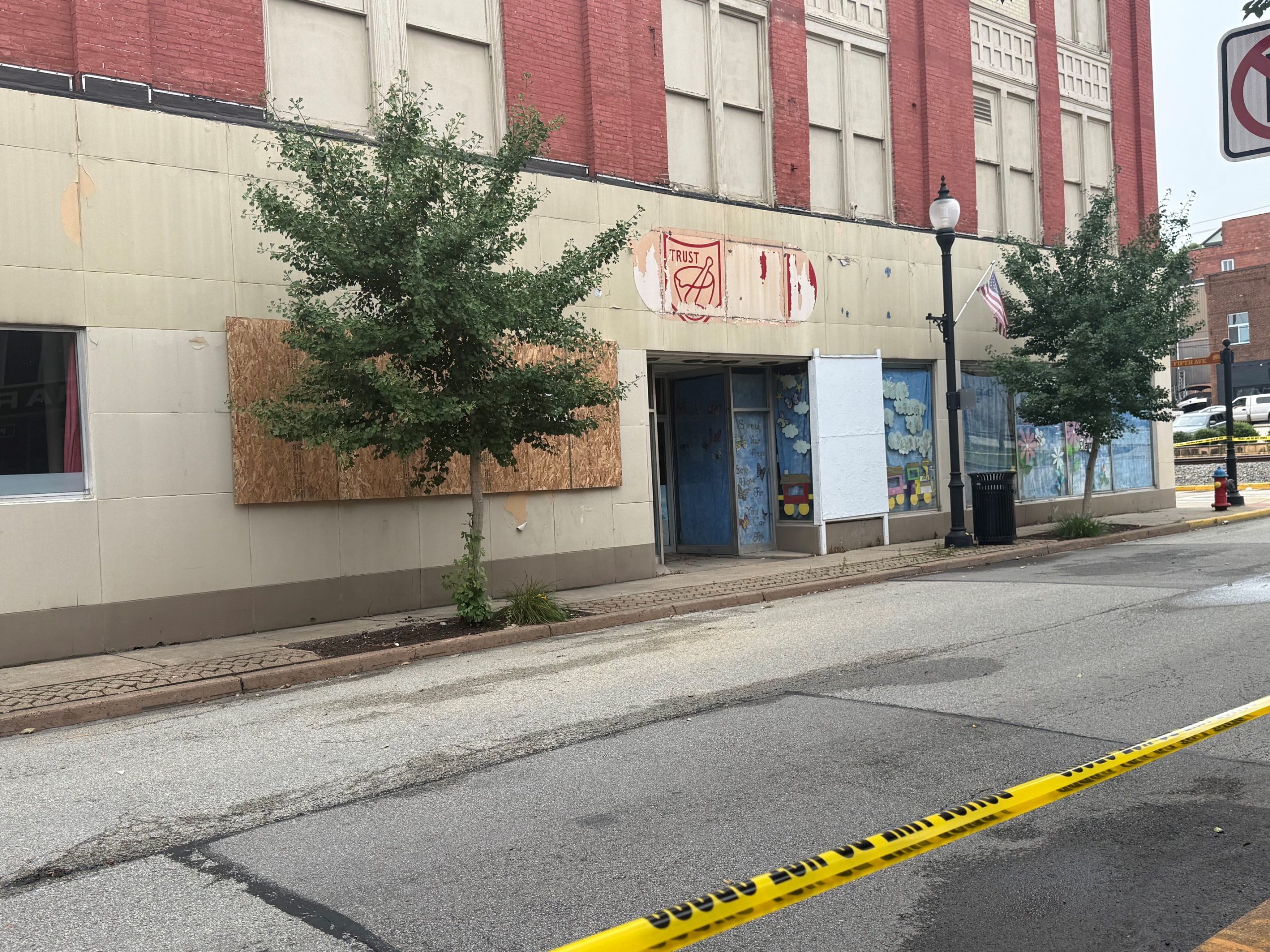 Front window glass cleanup and boarding at 411 Corbet Street, August 8